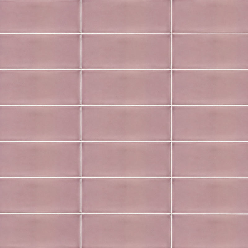 Joy Velvet Pink 4x10 ceramic wall tiles in muted pink with a horizontal stacked pattern and light grout lines.