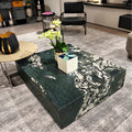 Krypton polished quartzite coffee table with dark green tones and bold ivory veining in a contemporary living room.