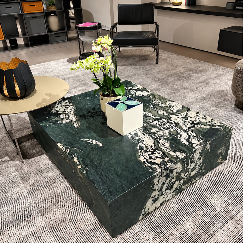 Krypton polished quartzite coffee table with dark green tones and bold ivory veining in a contemporary living room.