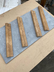 Close-up of Noce Toros Travertine Unfilled & Honed 2 x 12 Single Step Tile, in Noce tones.