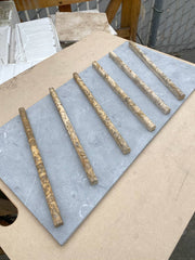 Close-up of Autumn Leaves Scabos Travertine Honed 1/2 x 12 Needle Tile, in Autumn tones.