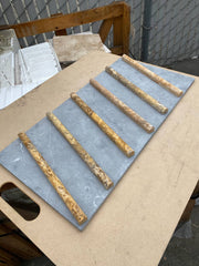 Close-up of Autumn Leaves Scabos Travertine Honed 3/4 x 12 Pencil Tile, in Autumn tones.