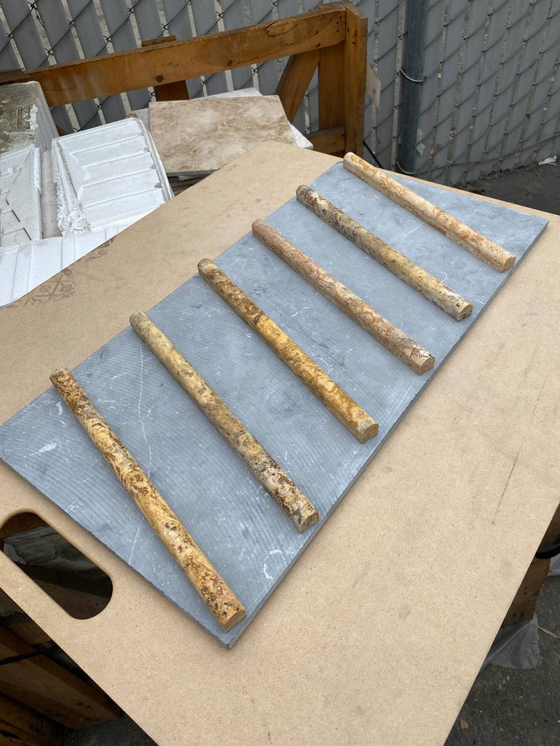 Close-up of Autumn Leaves Scabos Travertine Honed 3/4 x 12 Pencil Tile, in Autumn tones.