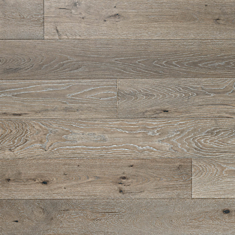 Ladson Milledge hardwood flooring with taupe brown planks, pale brushed grain and dark knots.