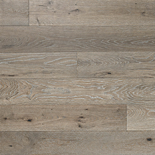Ladson Milledge hardwood flooring with taupe brown planks, pale brushed grain and dark knots.