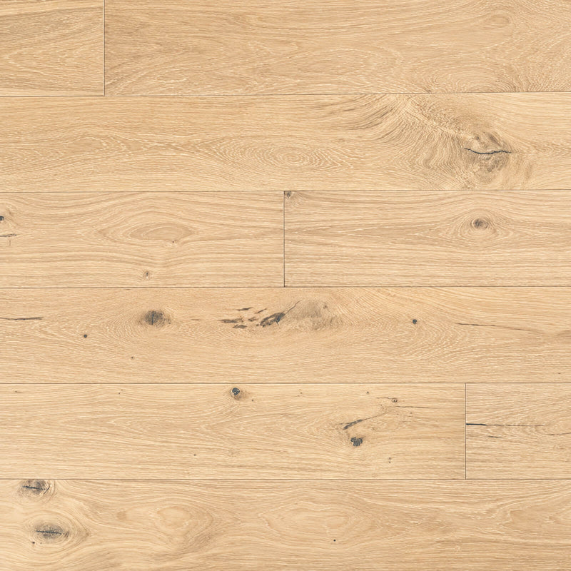 Ladson Whitlock 7x74 brushed genuine hardwood planks with light warm beige tones, natural knots and subtle white grain in a horizontal staggered layout.