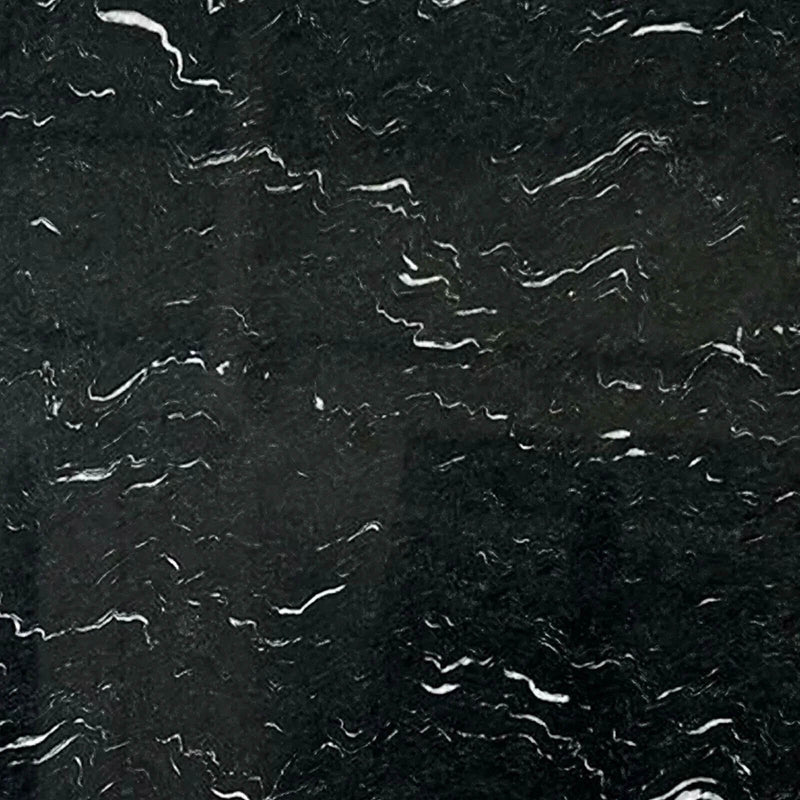 Laguna Black 3cm polished granite slab close-up with a dark charcoal background and short irregular white and gray mineral streaks.