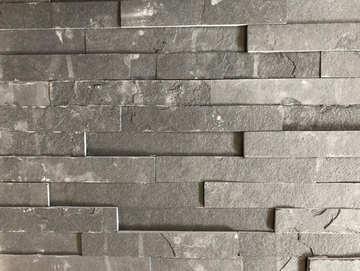 Close-up of Natural Stone River Split Face 6 x 24 Flat Panel Stone Veneer, in Natural tones.