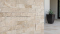 Close-up of Natural Cordoba Cream - Light Travertine Split Face 6 x 24 Flat Panel Stone Veneer, in Natural tones.