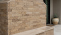 Close-up of Natural Noce Travertine Split Face 6 x 24 Flat Panel Stone Veneer, in Natural tones.
