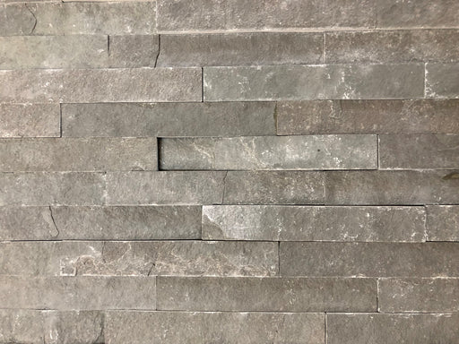 Close-up of Natural Stone INDIAN(LIME) Black Split Face 6 x 24 Flat Panel Stone Veneer, in Natural tones.