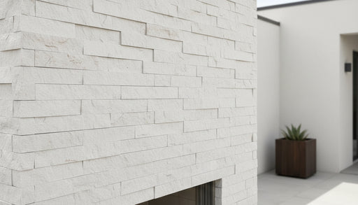 Close-up of Natural Stone Carrara White Split Face 6 x 24 Flat Panel Stone Veneer, in Natural tones.