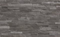 Close-up of Natural Stone Sea Grass Split Face 6 x 24 Flat Panel Stone Veneer, in Natural tones.