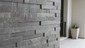 Close-up of Natural Stone Sea Grass Split Face 6 x 24 Flat Panel Stone Veneer, in Natural tones.