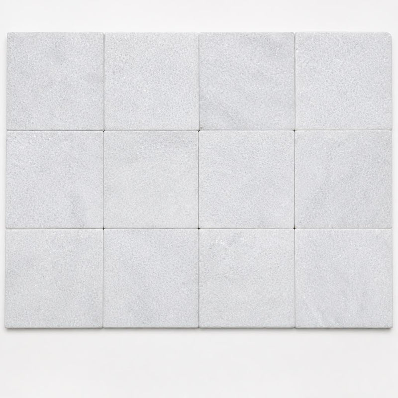Lusso Carrara 4x4 Tumbled Marble Tile close-up