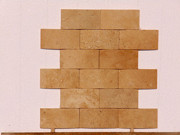 Close-up of Ivory Cordoba Cream Travertine Honed Wavy 2 x 4 Mosaic, in Ivory tones.