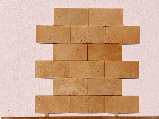 Close-up of Ivory Cordoba Cream Travertine Honed Wavy 2 x 4 Mosaic, in Ivory tones.