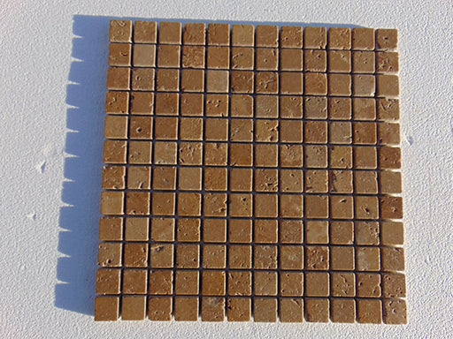 Close-up of Noce Toros Travertine Tumbled 1 x 1 Mosaic, in Noce tones.