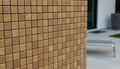 Close-up of Noce Toros Travertine Tumbled 1 x 1 Mosaic, in Noce tones.