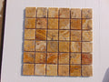 Close-up of Autumn Leaves Scabos Travertine Tumbled 2 x 2 Mosaic, in Autumn tones.