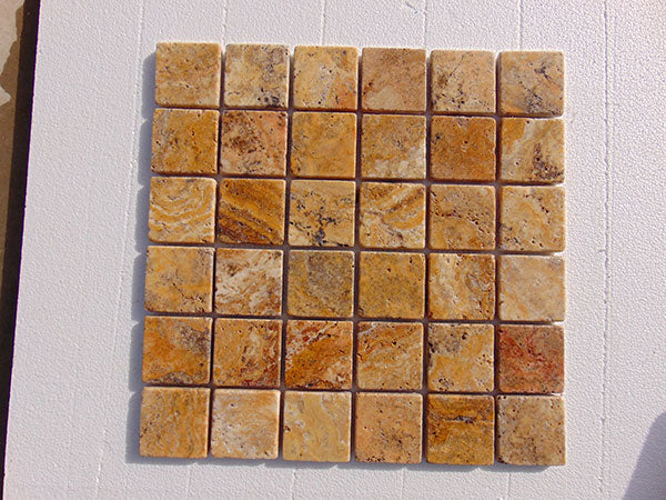 Close-up of Autumn Leaves Scabos Travertine Tumbled 2 x 2 Mosaic, in Autumn tones.