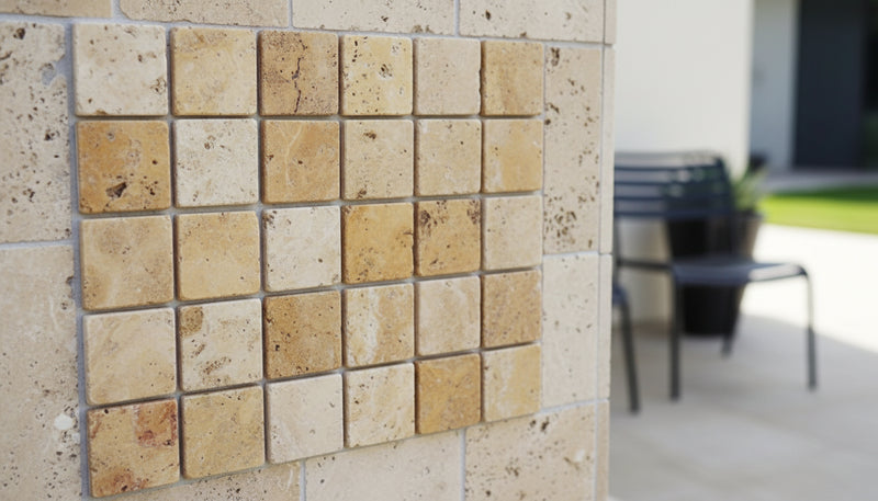Close-up of Autumn Leaves Scabos Travertine Tumbled 2 x 2 Mosaic, in Autumn tones.