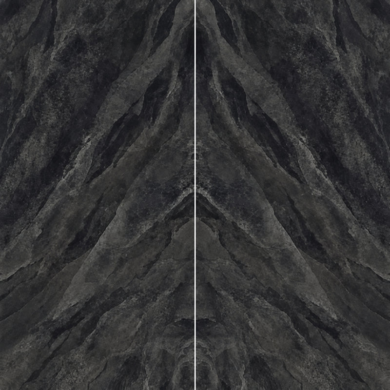 Magnifica Encore Pietra Scura honed porcelain slabs with mirrored charcoal-gray veining and a narrow central joint.