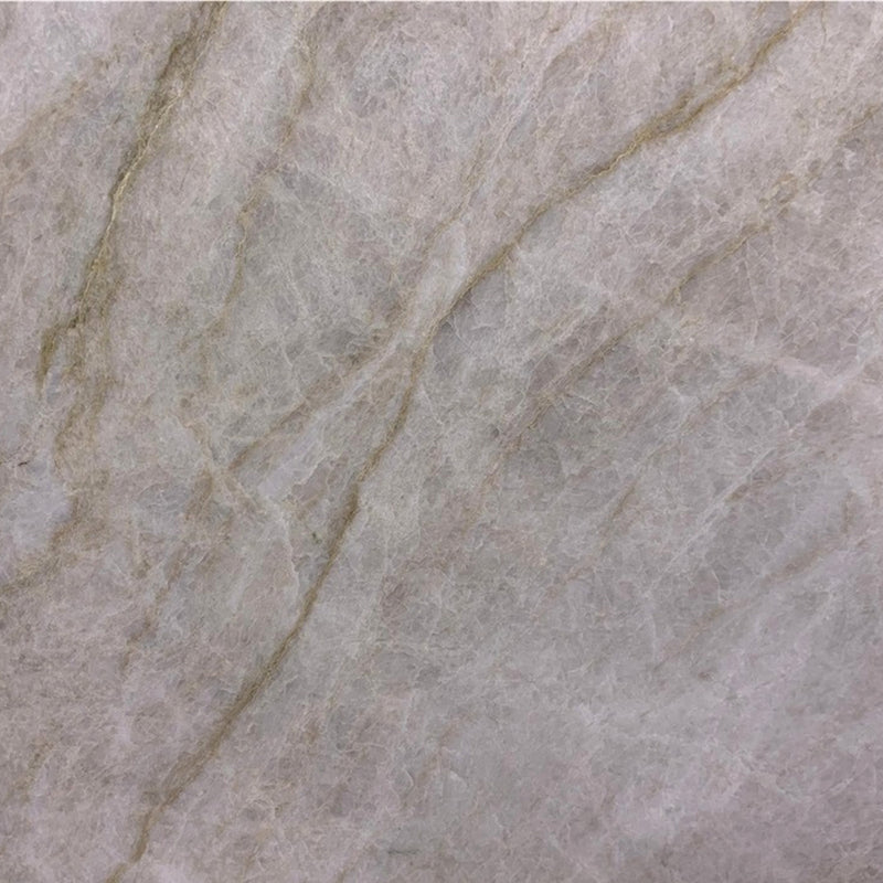 Matira honed quartzite with a light gray surface and soft beige diagonal veins.