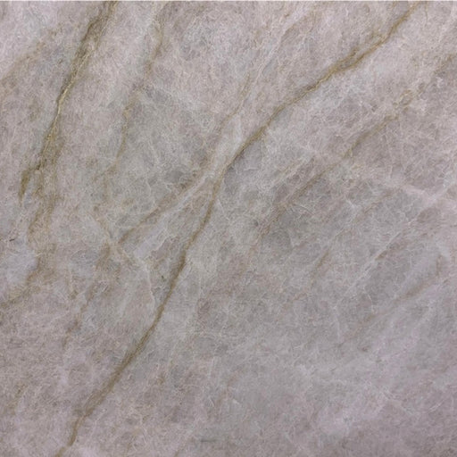 Matira honed quartzite with a light gray surface and soft beige diagonal veins.