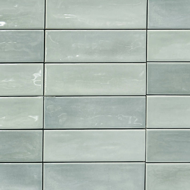 Mayolica Beret Tea 2x6 glossy ceramic tiles with pale green tones and a stacked rectangular layout.