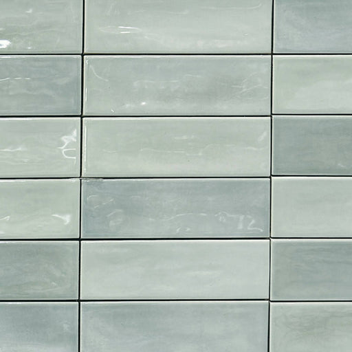 Mayolica Beret Tea 2x6 glossy ceramic tiles with pale green tones and a stacked rectangular layout.