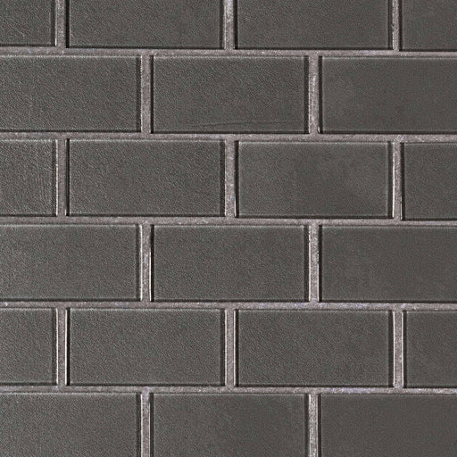 Metallic gray 2x4 glass subway mosaic tiles with a textured surface arranged in a staggered brick pattern.