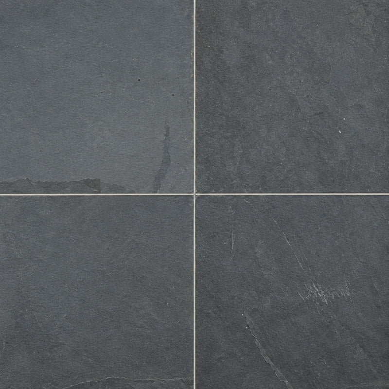 Four Montauk Blue natural stone pavers with dark blue-gray surfaces.
