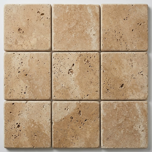 Beige Noce Travertine Coping 12x12 Tumbled Bullnose 1.25 inch close-up