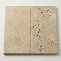 Noce Travertine Coping 12x24 Unfilled, Honed Bullnose 2 inch close-up