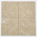 Noce Travertine Paver 16x16 Tumbled 1.25 inch close-up