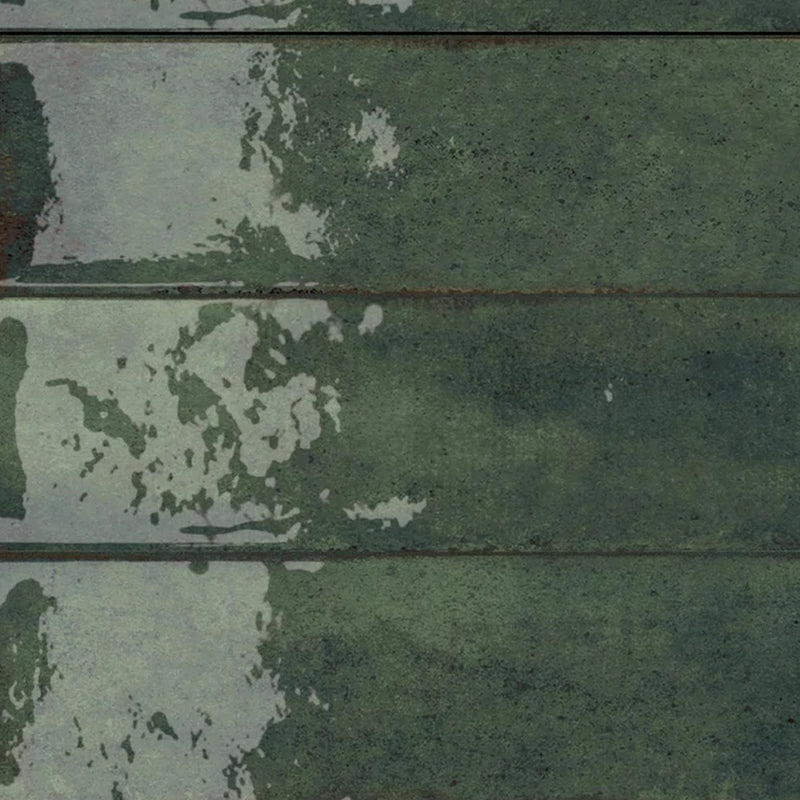 Novabell Fusion Smeraldo 2.5x10 porcelain tiles with deep green tones and irregular lighter patches arranged in horizontal rows.