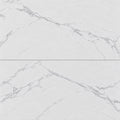 Close-up of Omnia Calacatta 12x24 matte marble look porcelain tiles with delicate gray veining and narrow grout joints.