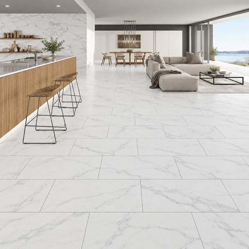 Omnia Calacatta 12x24 matte marble look porcelain tiles with subtle gray veining in a modern kitchen and living room.