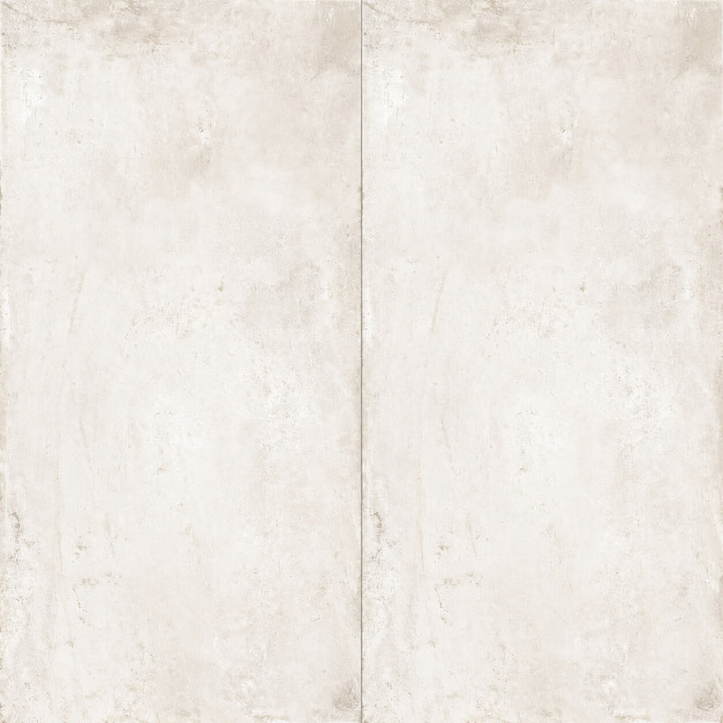One Chalk 24x12 matte ceramic porcelain tile in warm ivory with subtle beige and gray concrete-look texture, shown as two rectangular tiles side by side.
