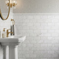 Oriental White (Asian Statuary) Marble 3x6 Tumbled Tile — Powder Room wainscot