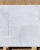 Close-up of White Marble Leather (Sandblasted & Brushed) French Versailles x 1.25 Paver, in White tones.