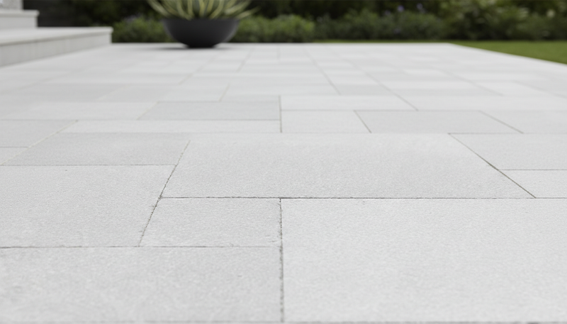 Close-up of Antalya Cream Marble Leather (Sandblasted & Brushed) French Versailles x 1.25 Paver, in Cream tones.