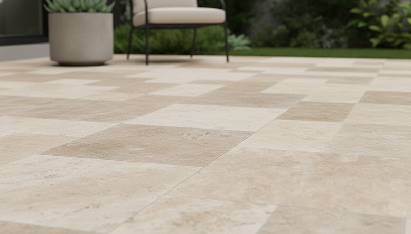 Close-up of Ivory Cordoba Cream Travertine Tumbled French Versailles x 1.25 Paver, in Ivory tones.