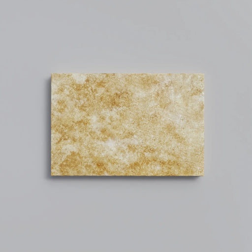 Close-up of Chocolate Brown Walnut Travertine Tumbled 16 x 24 x 1.25 Paver, in Brown tones.