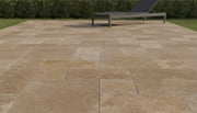 Close-up of Noce Travertine Tumbled Roman x 1.25 Paver, in Noce tones.