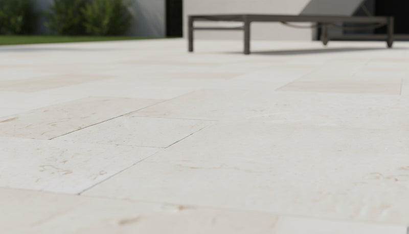 Close-up of Desert Sand Limestone Tumbled French Versailles x 1.25 Paver, in Desert Sand tones.