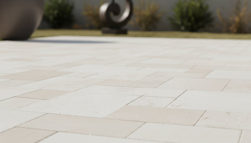 Close-up of Desert Sand Limestone Tumbled Roman x 1.25 Paver, in Desert Sand tones.