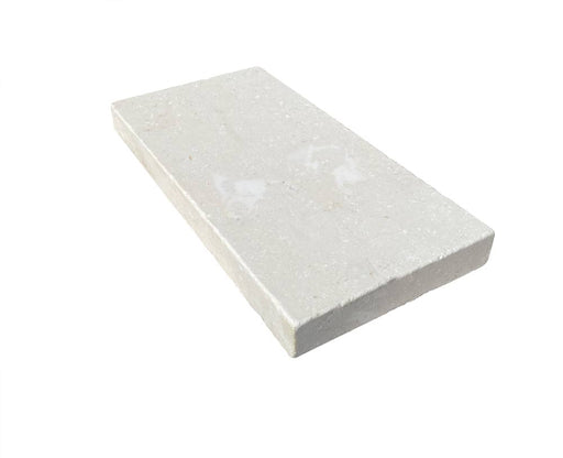 Close-up of Desert Sand Limestone Tumbled 6 x 12 x 1.25 Paver, in Desert Sand tones.