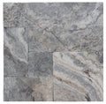 Close-up of Silver Travertine Tumbled French Versailles x 1.25 Paver, in Silver tones.